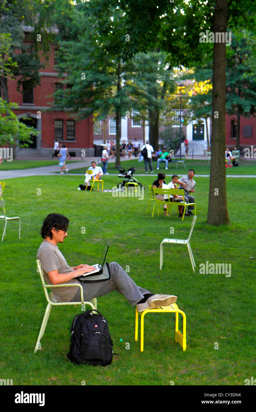 Cambridge Massachusetts,Boston Harvard University,campus,Harvard Yard,man men male adult adults,student students chairs,sitting,laptop computer,using, Stock Photo