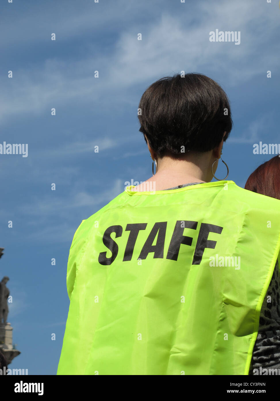 women wearing staff vest at event outdoors Stock Photo - Alamy