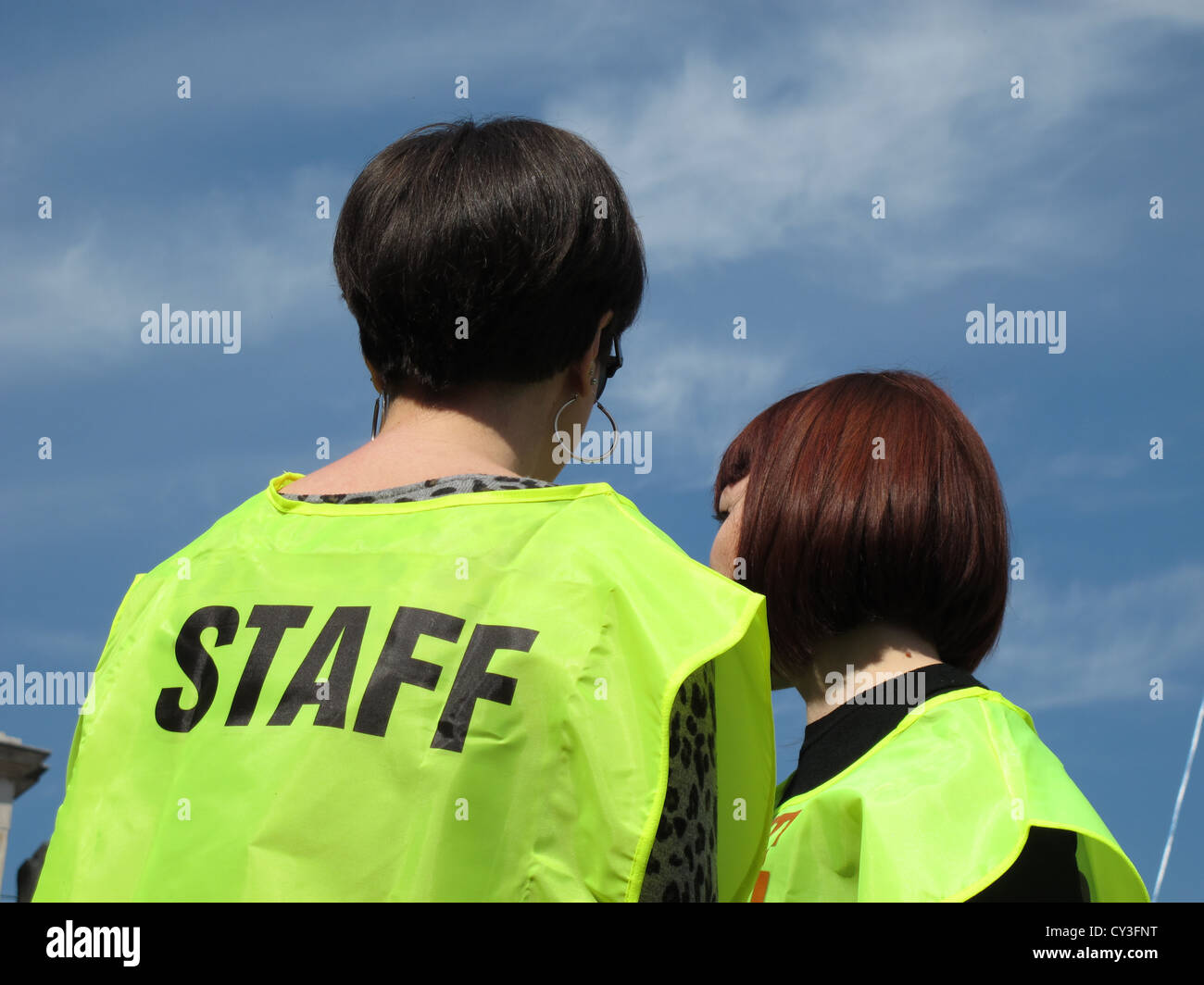 women wearing staff vest at event outdoors Stock Photo - Alamy