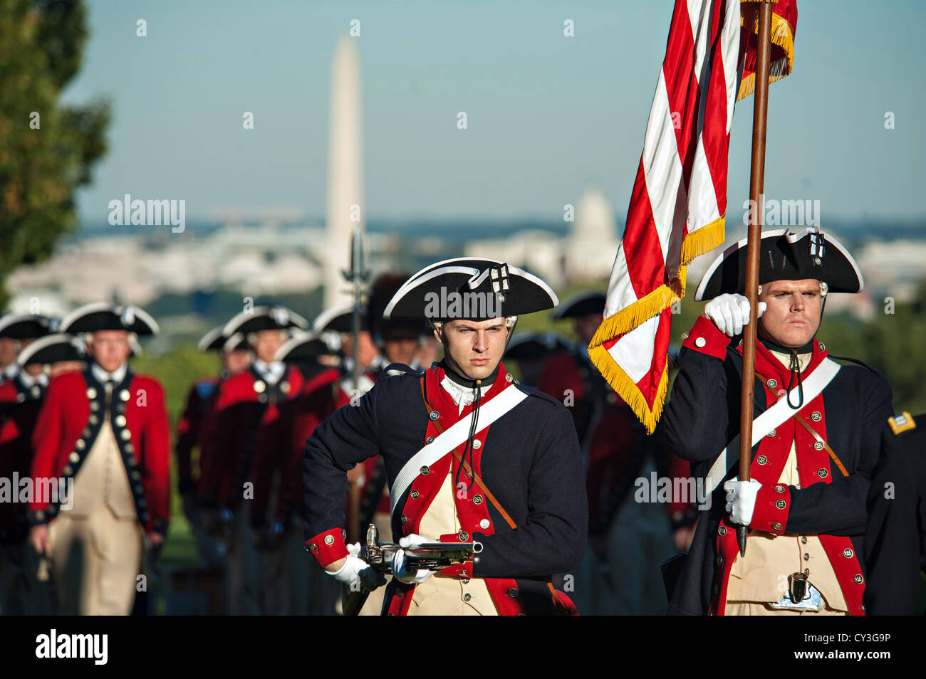 US Army Soldiers from the 3rd Infantry Regiment The Old Guard and the Fife and Drum Corps perform during Twilight Tattoo ceremony October 11, 2012 in Joint Base Myer-Henderson Hall, Virginia. Stock Photo