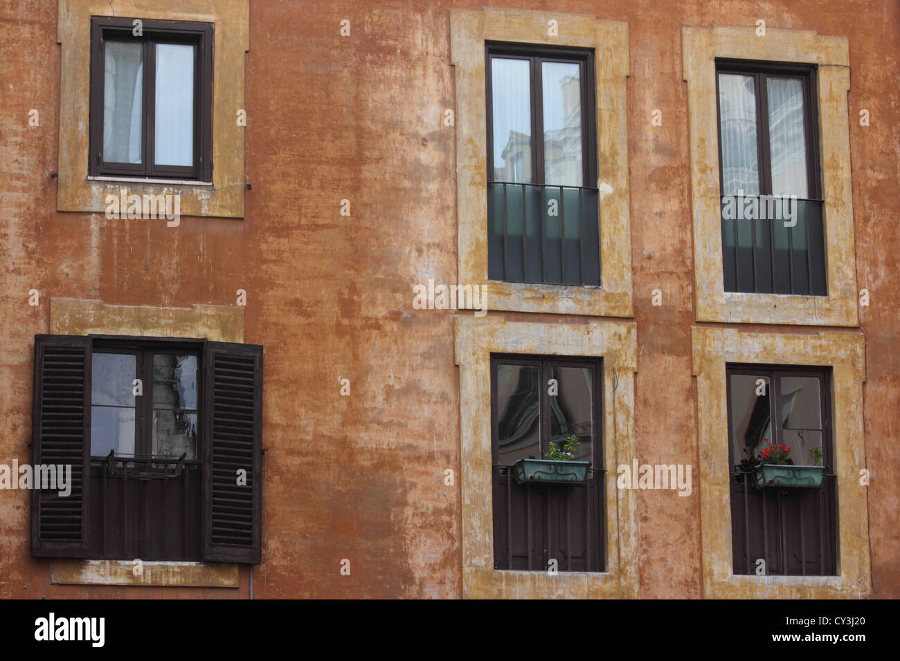 beautiful old building front faces in the center of Rome, Italy, urban, archtecture, windows, decayed walls, photoarkive Stock Photo