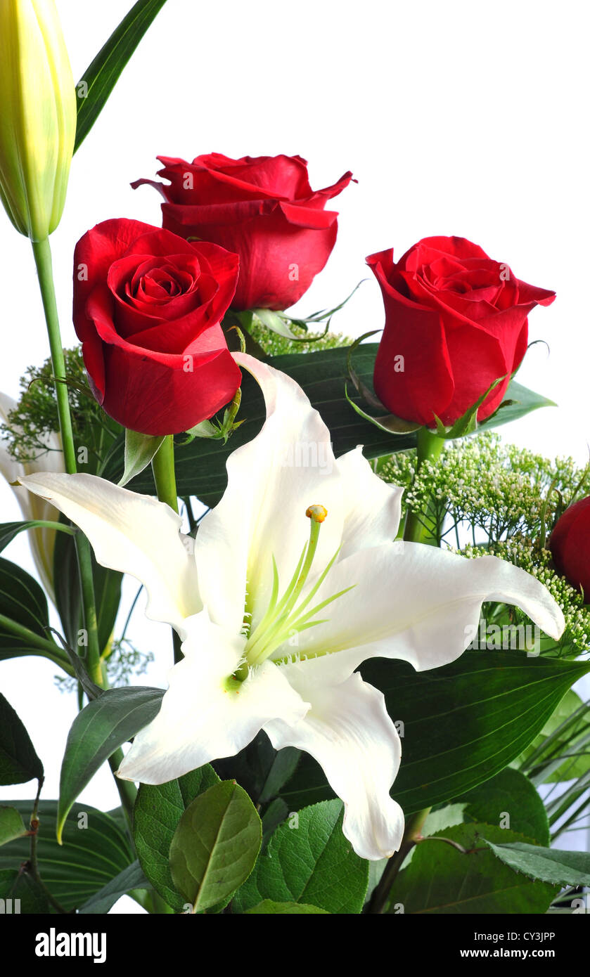 Bouquet of red roses and white lily, on white background Stock Photo