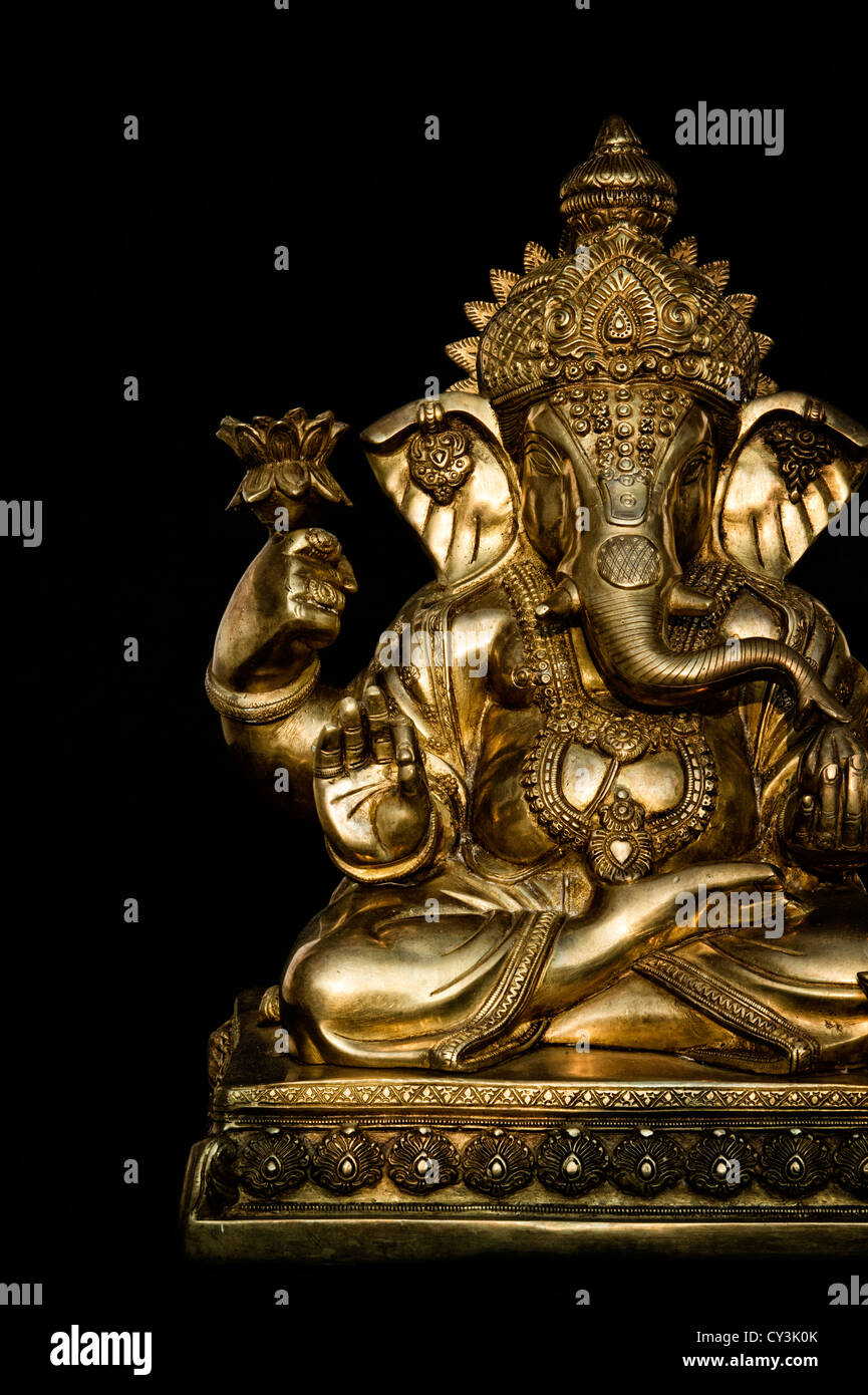 Hindu Elephant God. Lord Ganesha statue against black background Stock  Photo - Alamy