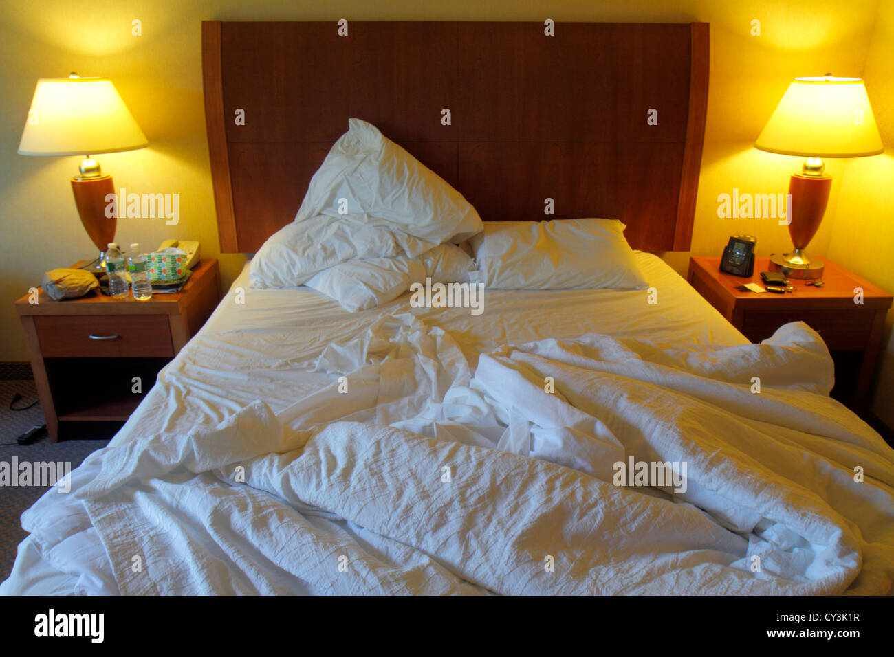 Maine,Northeast,New England,Freeport,Hilton Garden Inn,motel,hotel hotels lodging inn motel motels,guest room,queen size bed,unmade,pillows,lamps,tabl Stock Photo