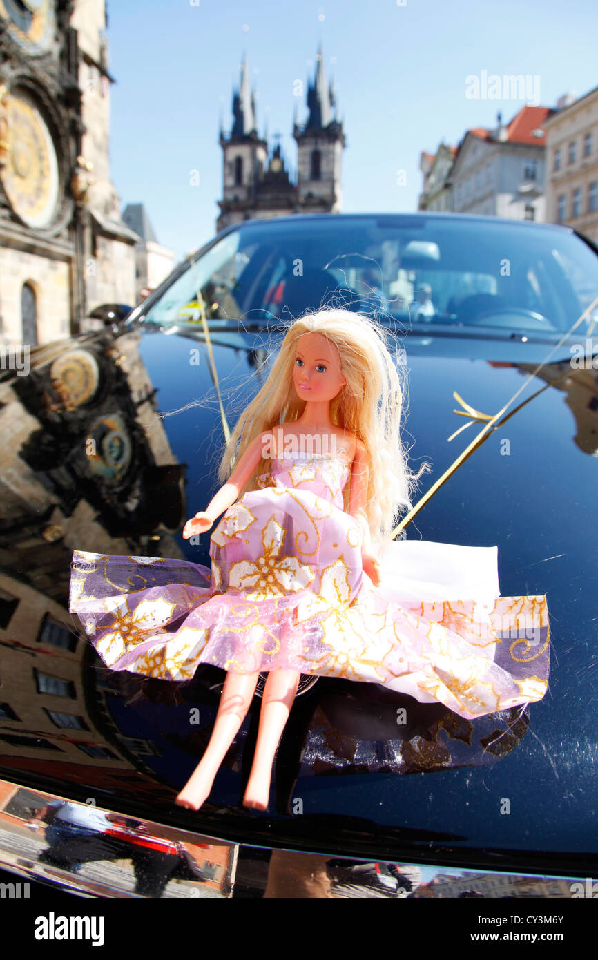 Barbie Doll toy on front of a wedding car in Prague, Czech Republic Stock Photo