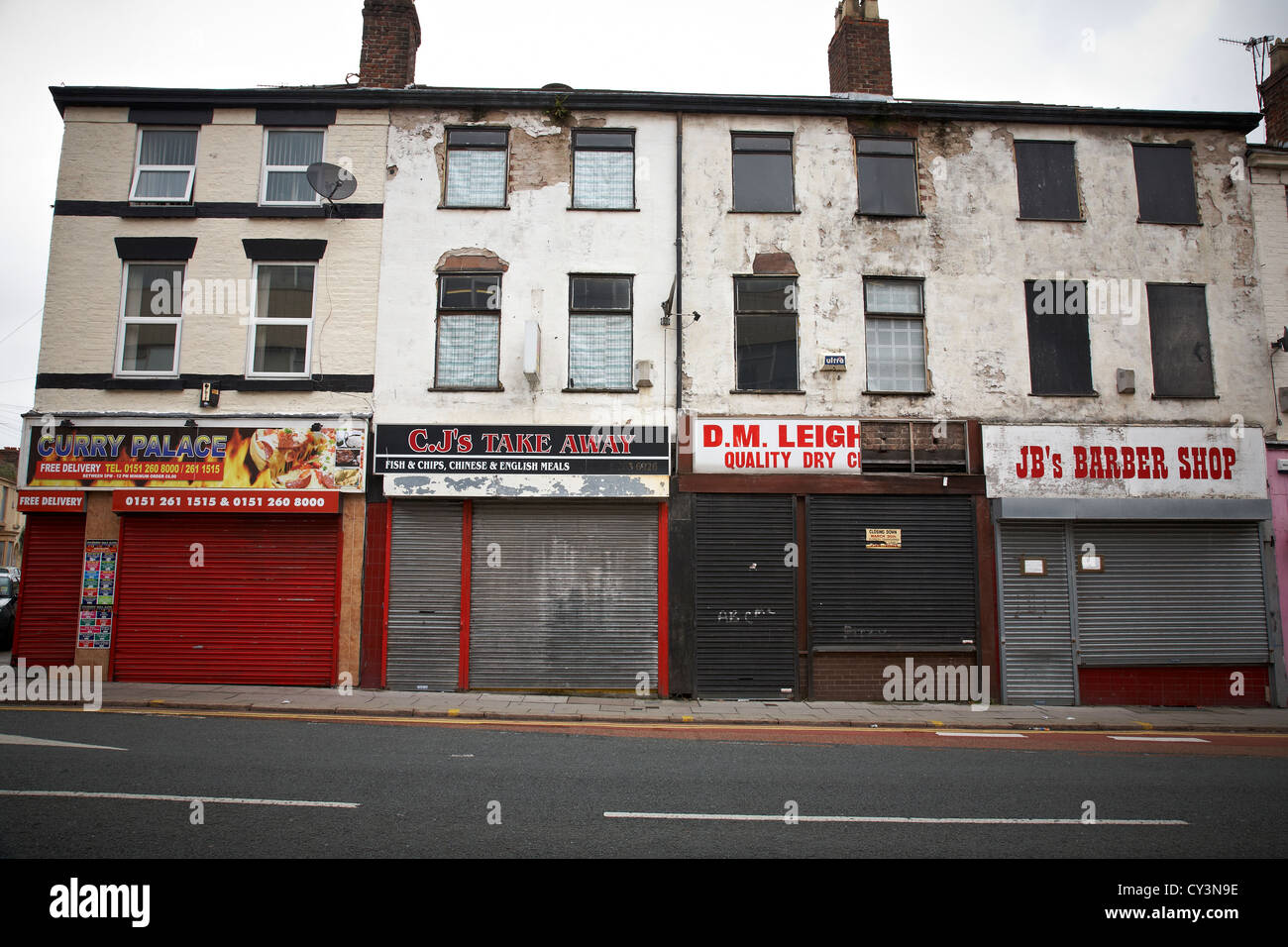 Row of closed down shops in Liverpool UK Stock Photo