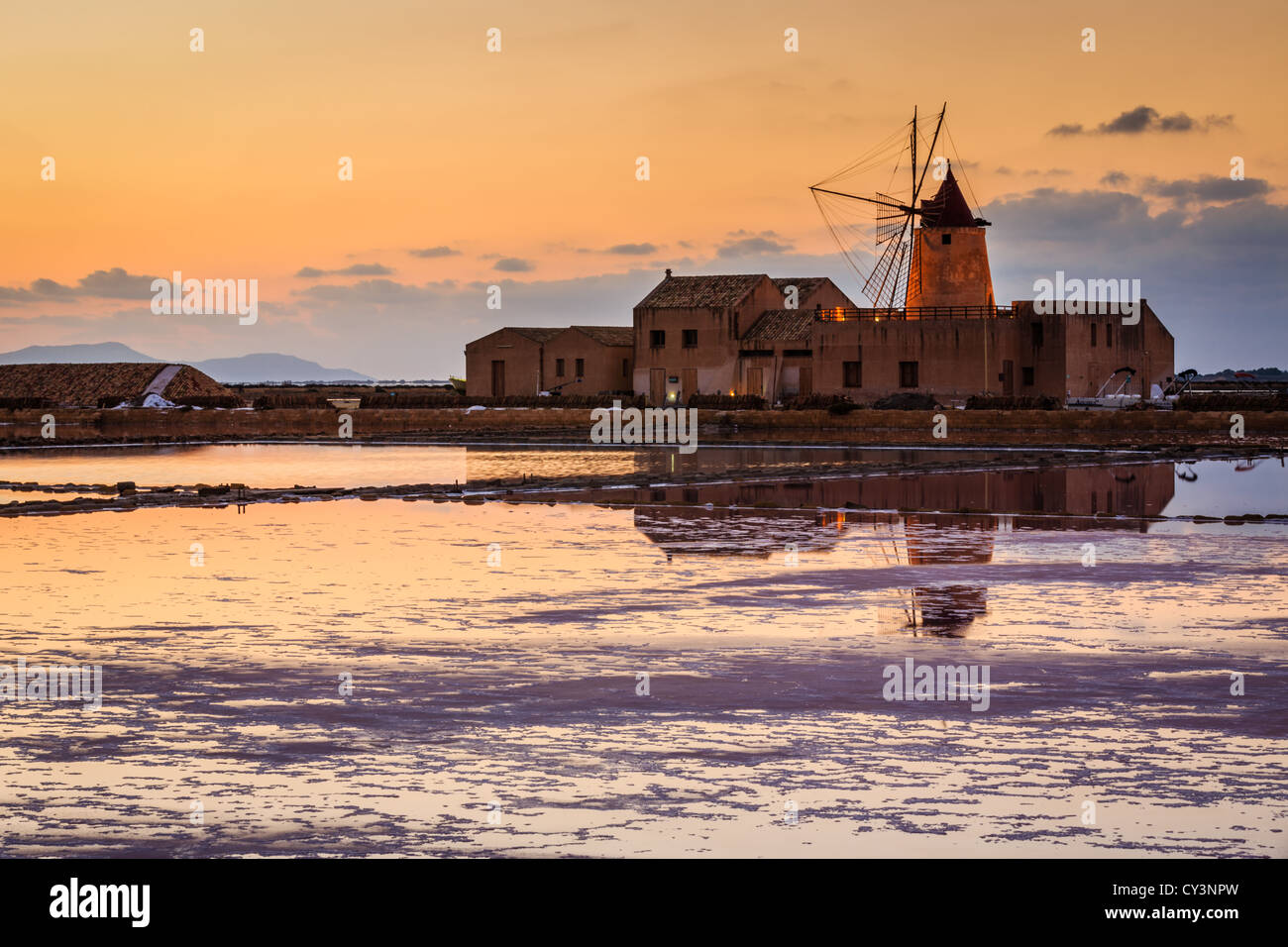 Sunset at the old saltworks in the Laguna dello Stagnone near Trapani, Sicily, Italy Stock Photo