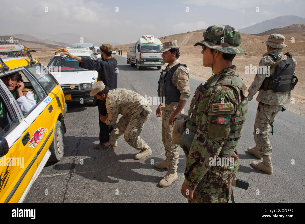 Afghan police and military checkpoint looking for suspected terrorists Stock Photo