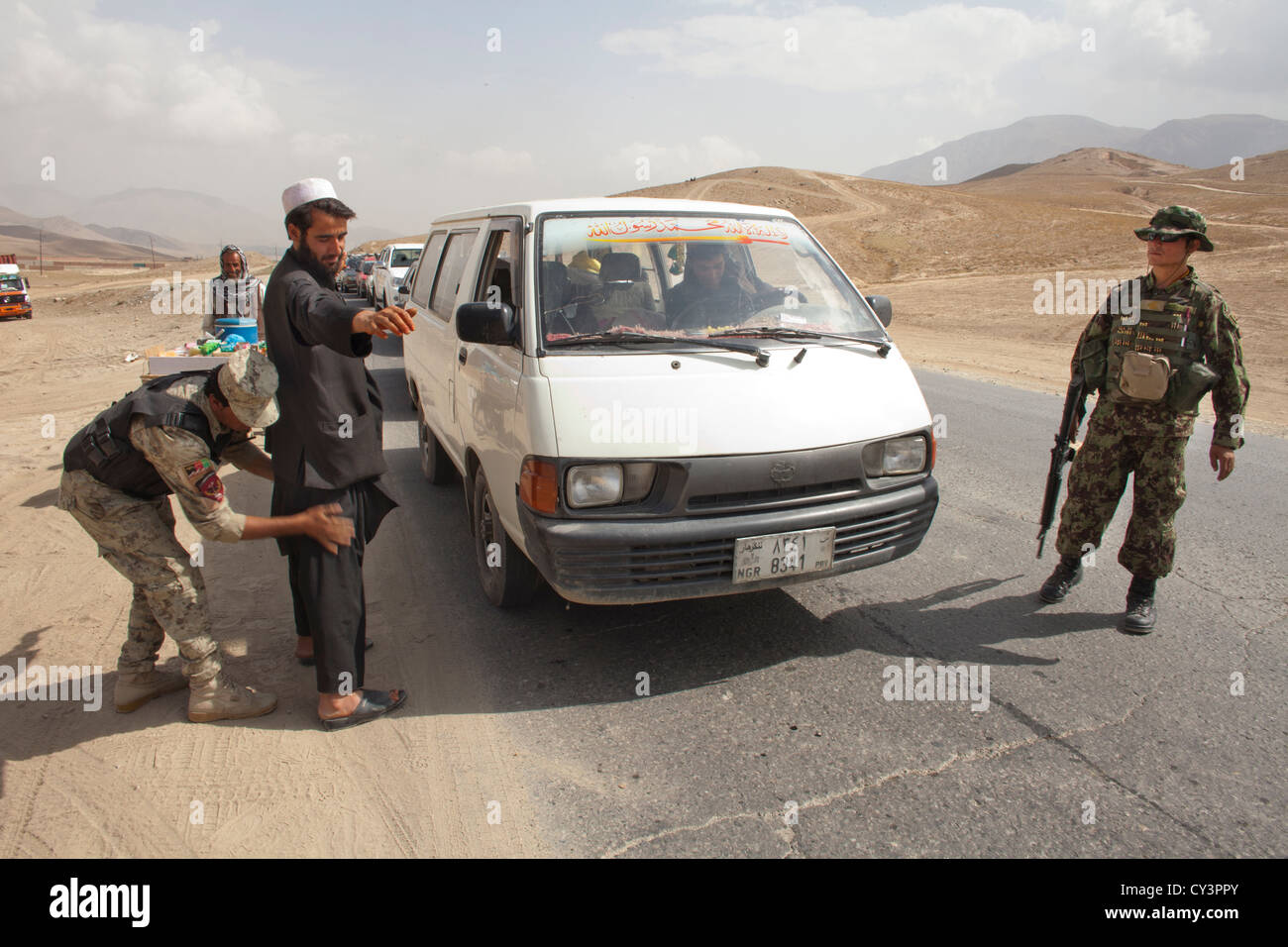 Afghan police and military checkpoint looking for suspected terrorists Stock Photo