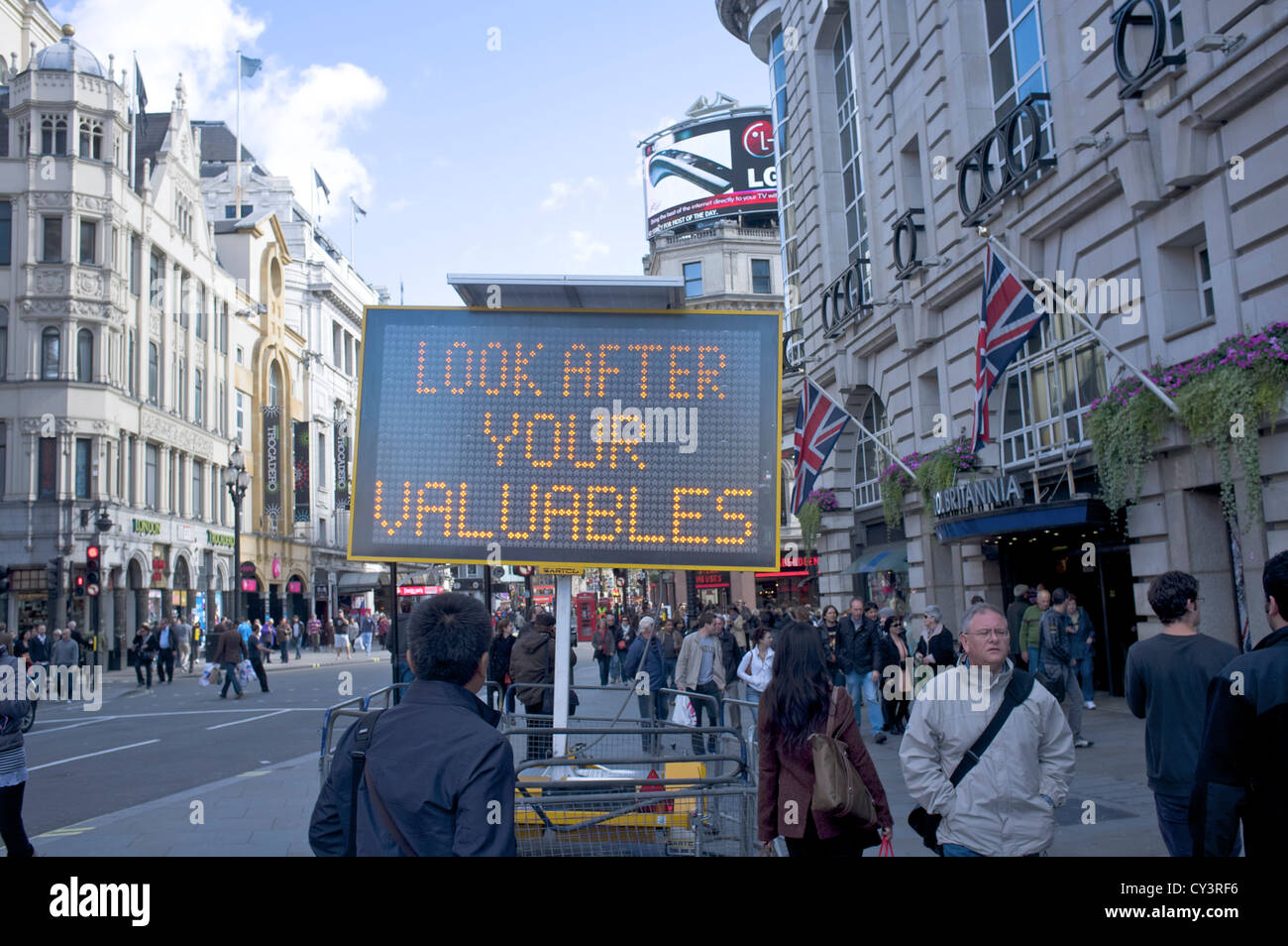 Look after your valuables illuminated sign in Piccadilly Circus London Stock Photo