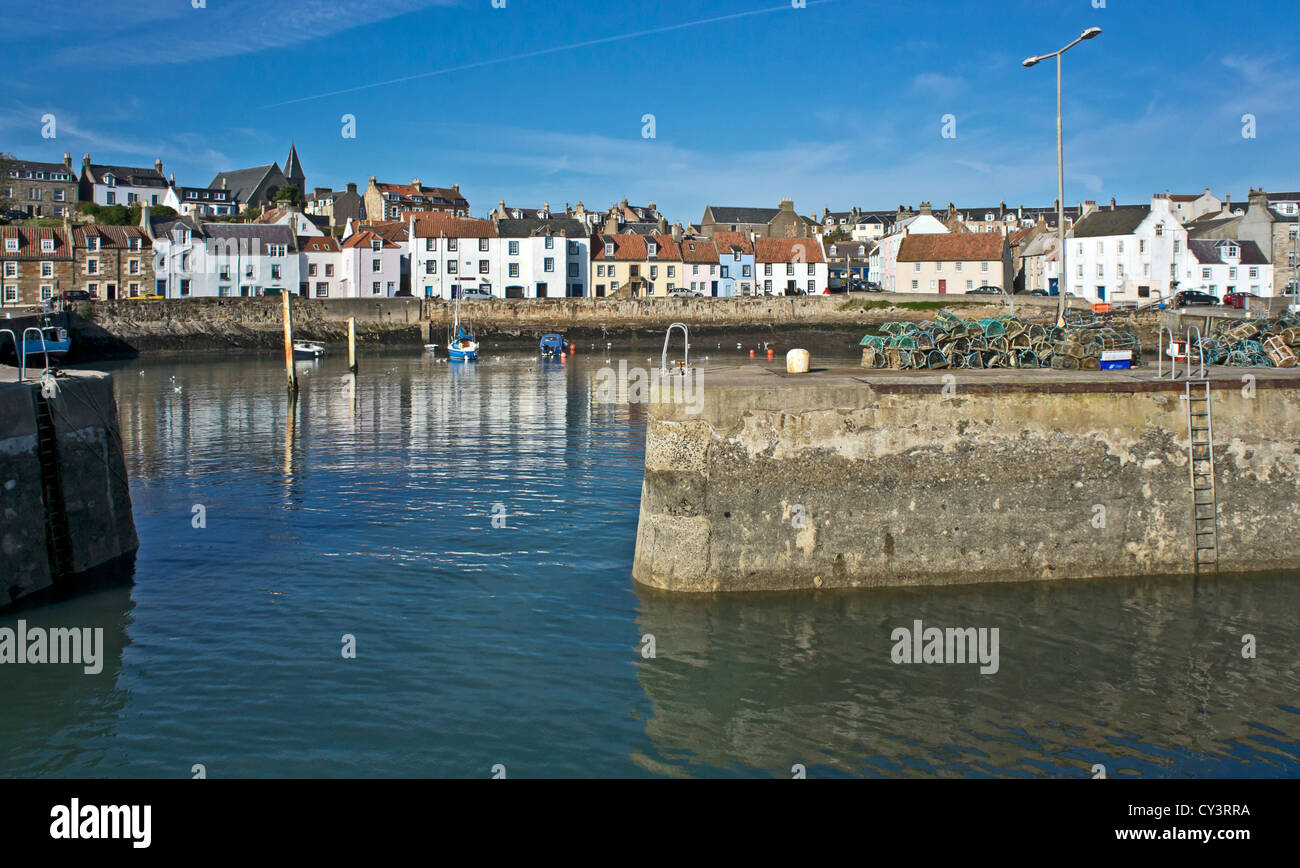 Entrance to the inner harbour in St Monans The Neuk of Fife Scotland with houses along West Shore Stock Photo