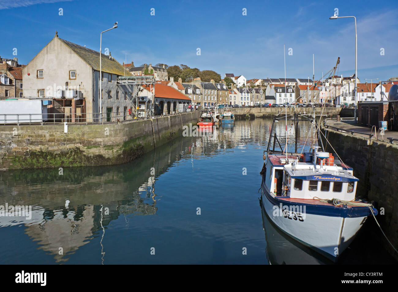 Pittenweem harbour in the East Neuk of Fife in Scotland with the Fish Market to the left. Stock Photo