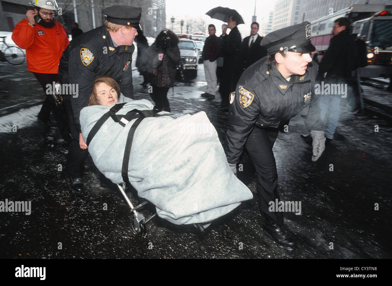 New York, NY - 26 February 1993 - First Responders evacuate workers, through snow and falling ice, after the 1993 bombing of the World Trade Center Stock Photo