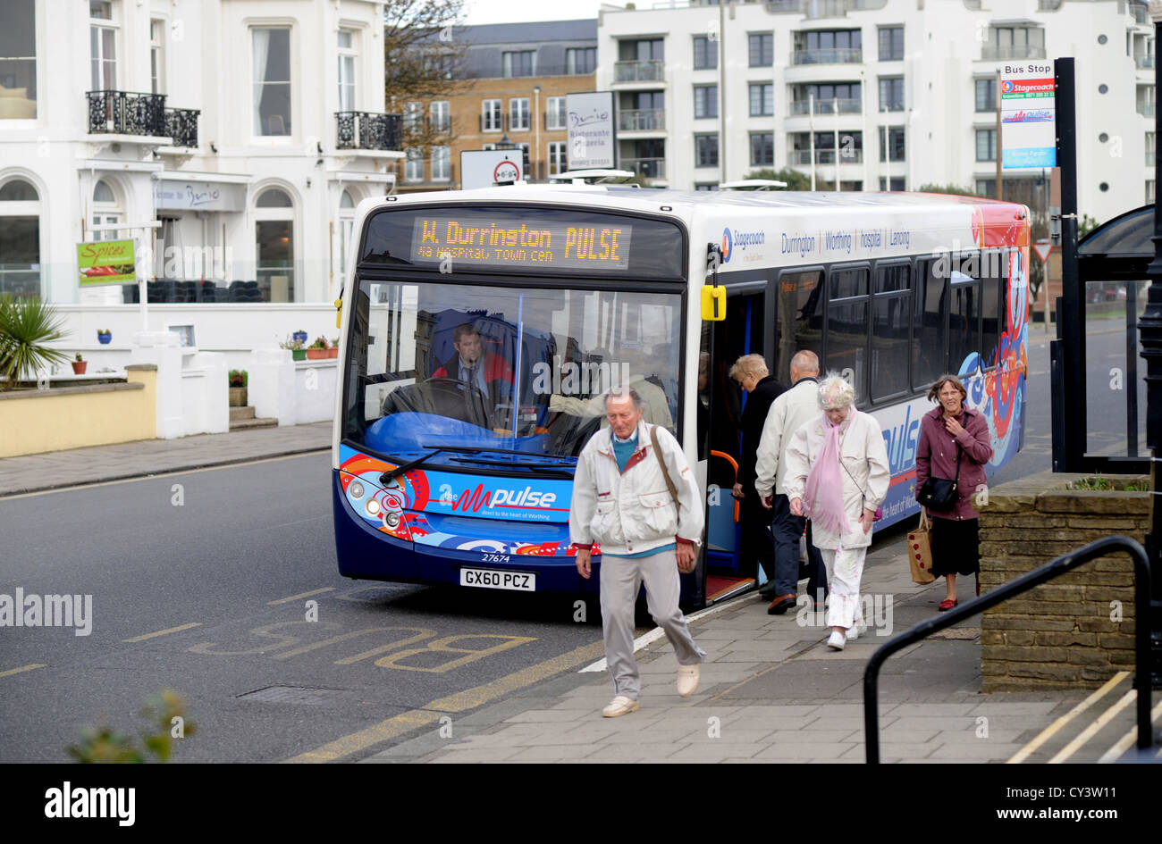 Disembarking from a single decker Pulse bus Worthing seafront UK Stock Photo
