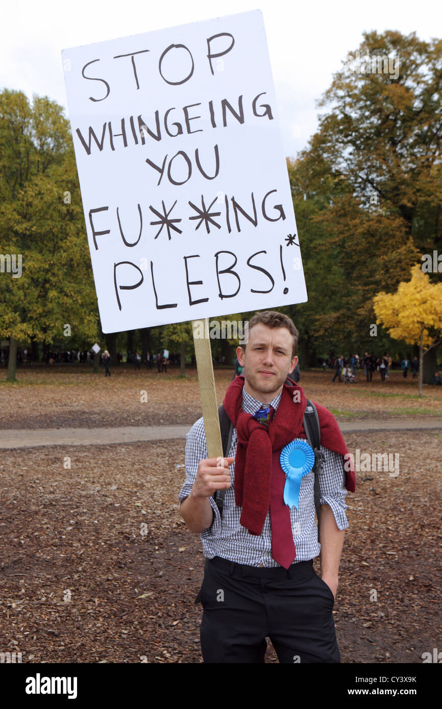 Plebs placard. Anti austerity and government cuts protester at A Future That Works, London. Carrying placard, London UK Stock Photo