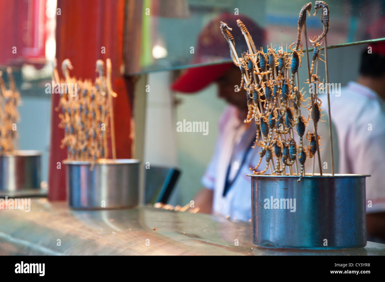 Skewered scorpions and sea horses for sale at the Donghuamen Night Market, on Wangfujing Street in Beijing, China. Stock Photo