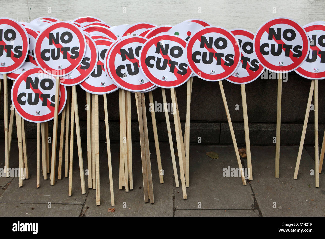 Numerous 'No Cuts' protest placards awaiting collection by protesters, A Future that Works, London Stock Photo