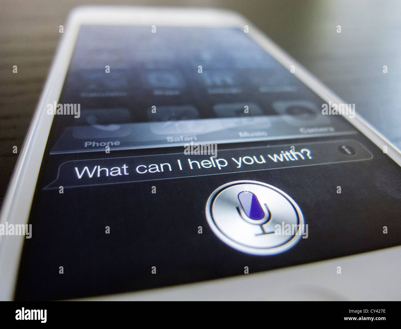 Detail of new iPhone 5 smart phone screen showing Siri voice control