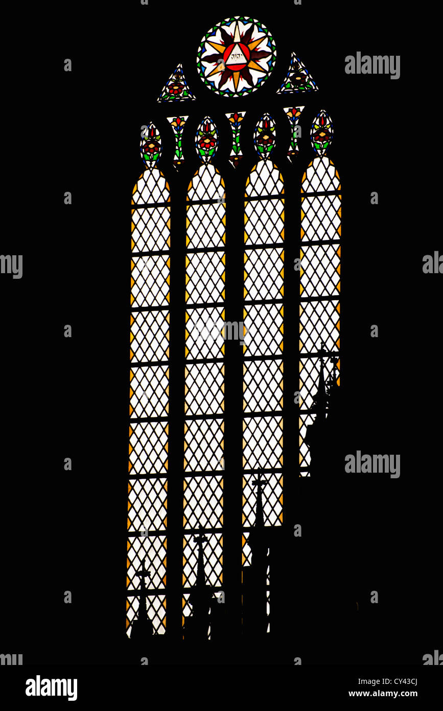 Darkness and bright window in a cathedral Stock Photo