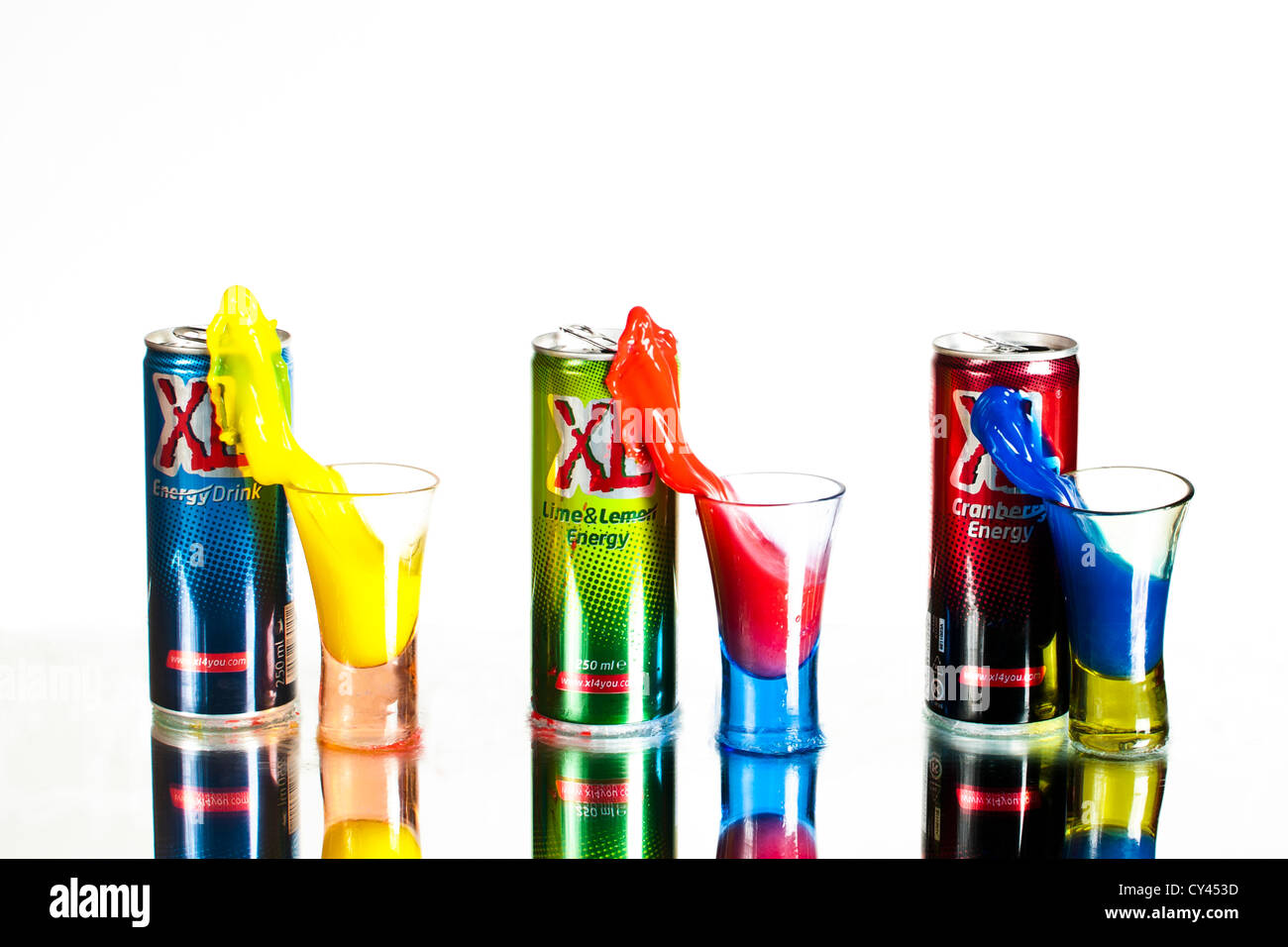 Colourful energy drinks pouring into glasses. Stop motion High-Speed photography technique Stock Photo