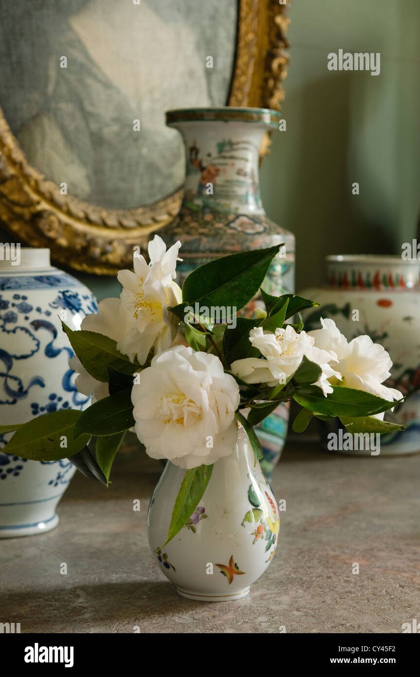White camellias in a small vase Stock Photo