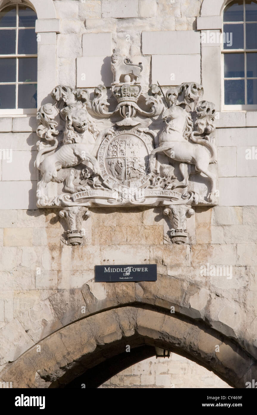 the royal coat of arms above the middle tower archway at the tower of london, england Stock Photo