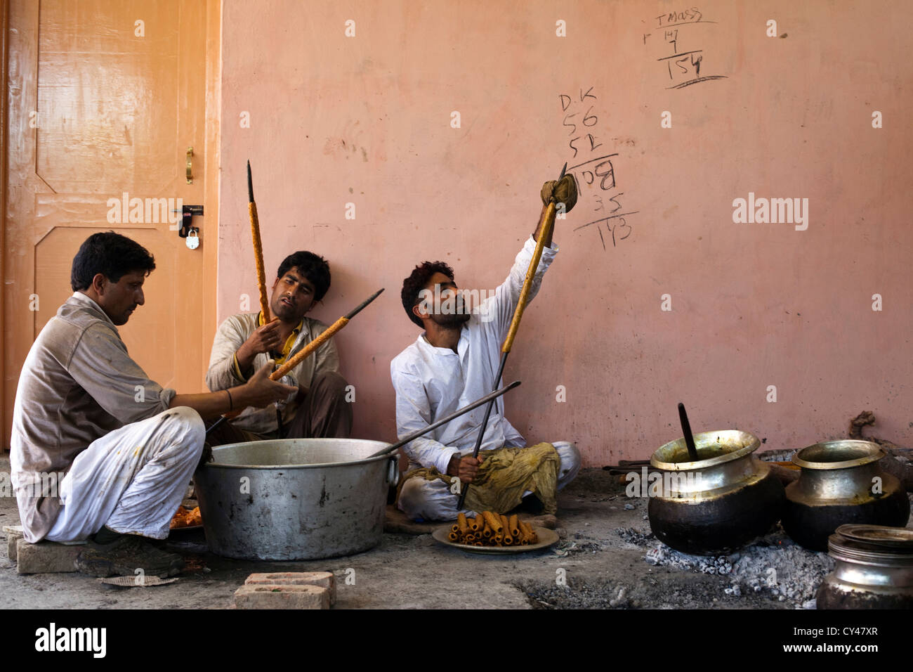 Wazas or cooks in the Wazwan tradition prepare kebabs in preparation