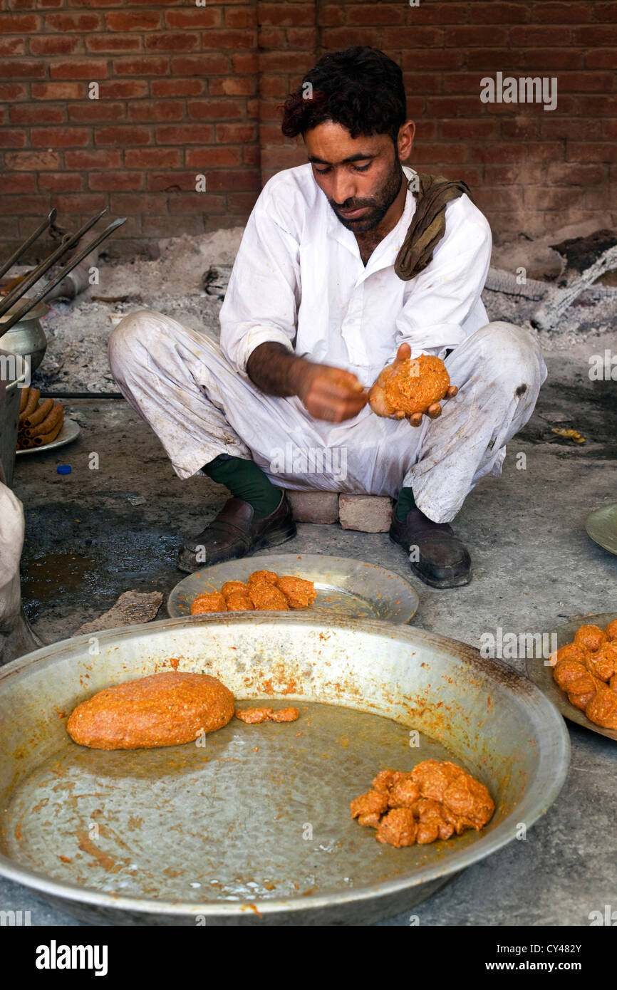 Wazas, traditional Kashmiri cooks, prepare a Wazwan a Kashmiri feast