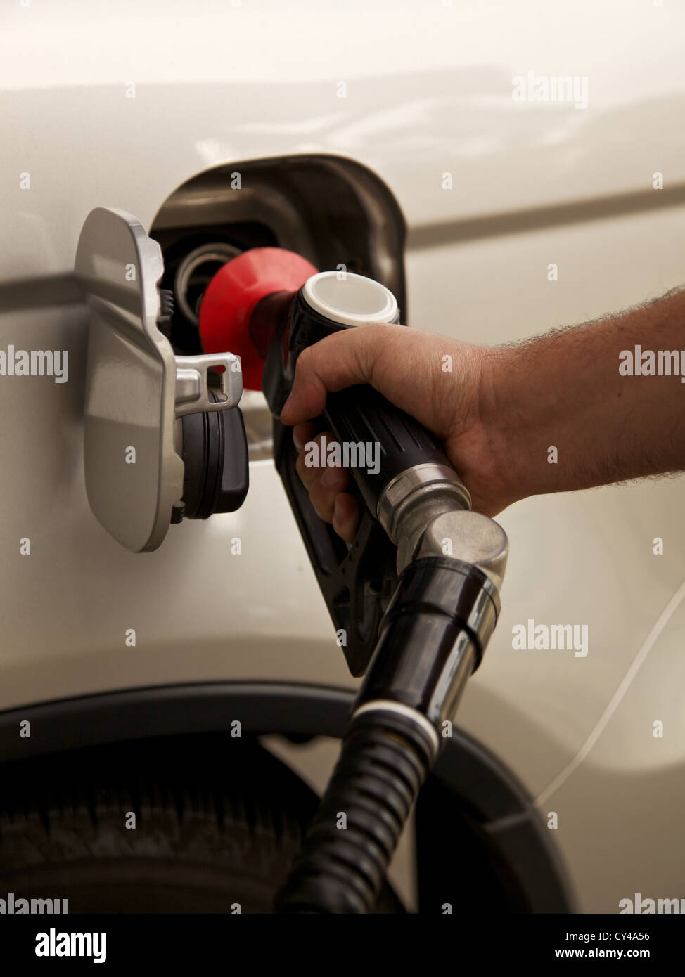 Person filling petrol into a car Stock Photo Alamy