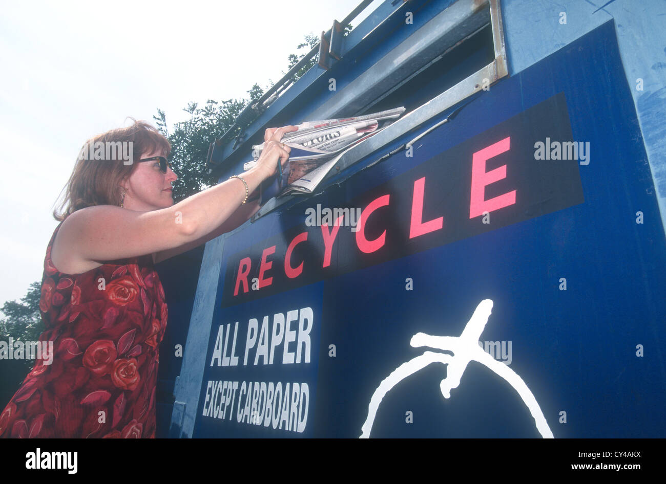 Woman recycling newspapers, London, UK Stock Photo Alamy