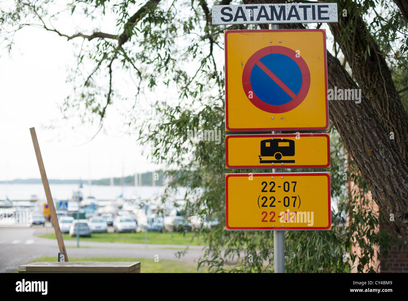 Traffic sign restricting the times during which camping in this area is allowed Stock Photo