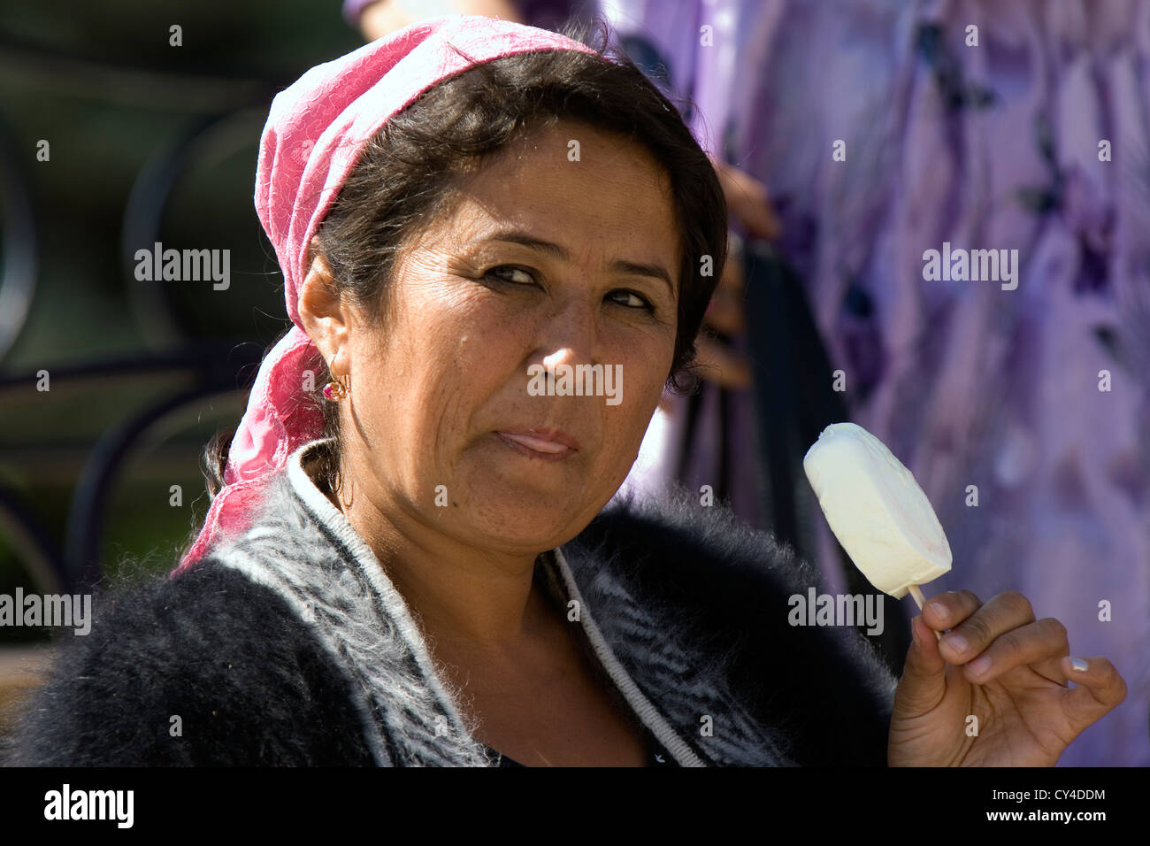 Uzbek woman having fun and dancing, Samarkand, Uzbekistan Stock Photo
