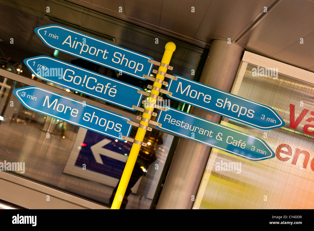 Signs in an airport directing passengers to shops, cafes and restaurants Stock Photo