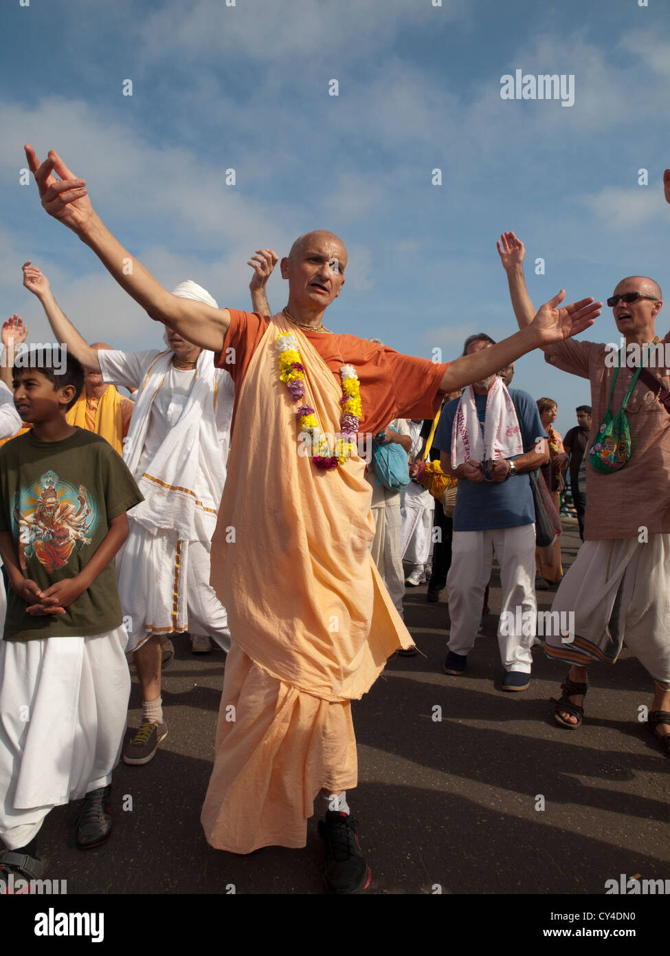 Members of the Hare Krishna movement gather to sing and dance on the seafront at Brighton. Stock Photo