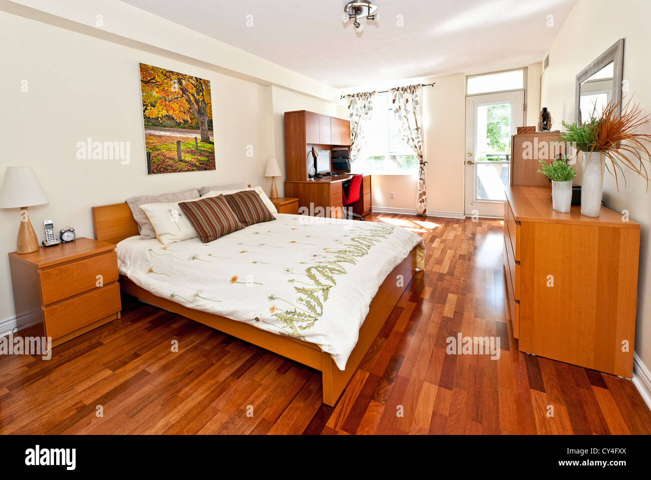 Bedroom interior with hardwood floor - artwork is from photographer portfolio Stock Photo