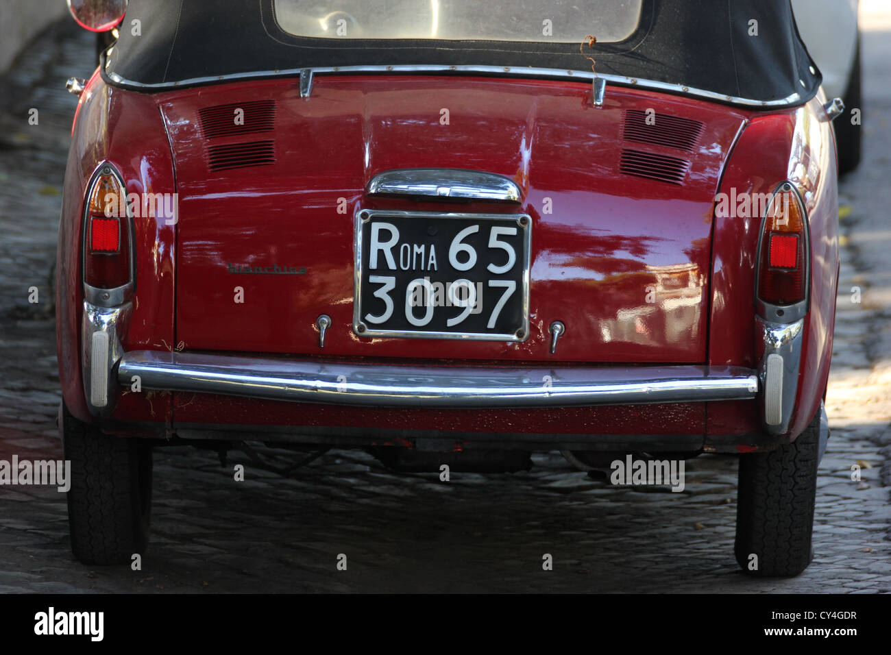 a beautiful picture of a fun romantic cabrio topolino red CAR, fiat 600, Roma, rome, Rome, Italy, detail, photoarkive Stock Photo