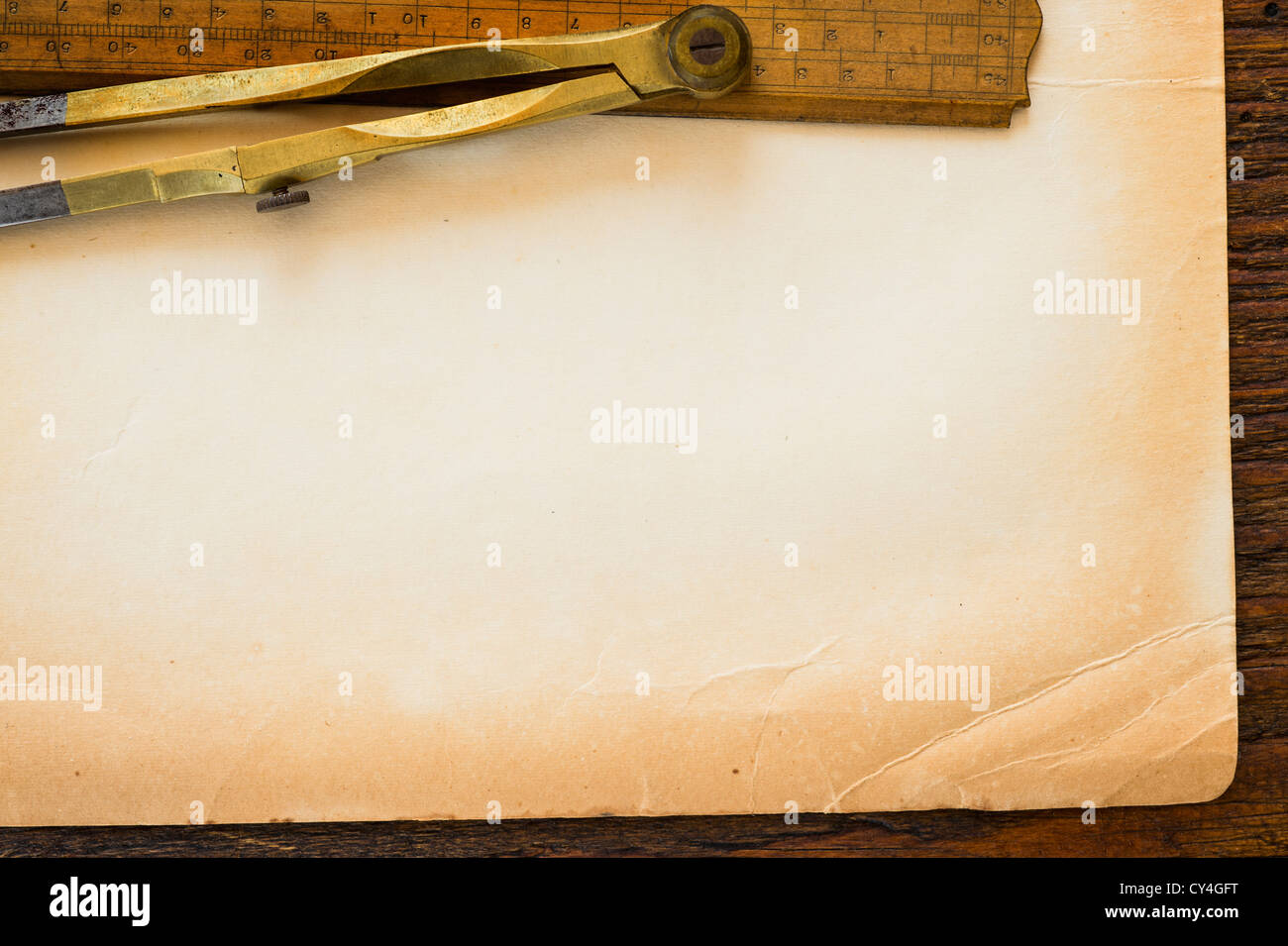Old brown paper with ruler and compass, studio shot Stock Photo - Alamy