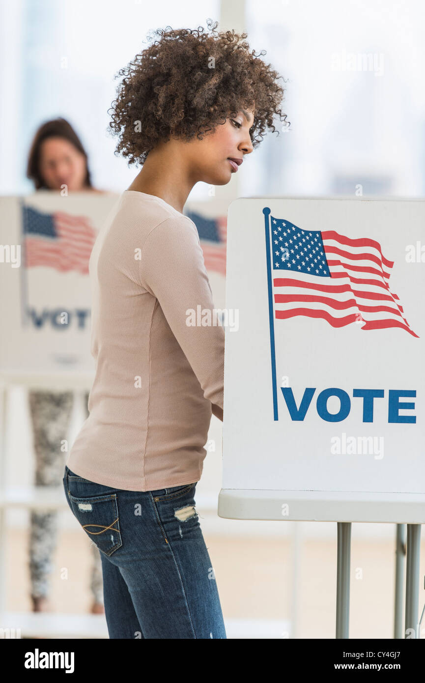 USA, New Jersey, Jersey City, Woman in voting booth Stock Photo