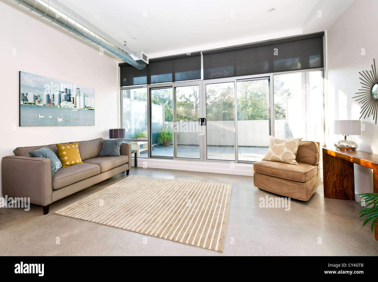 Living room with sliding glass door to balcony - artwork from photographer portfolio Stock Photo