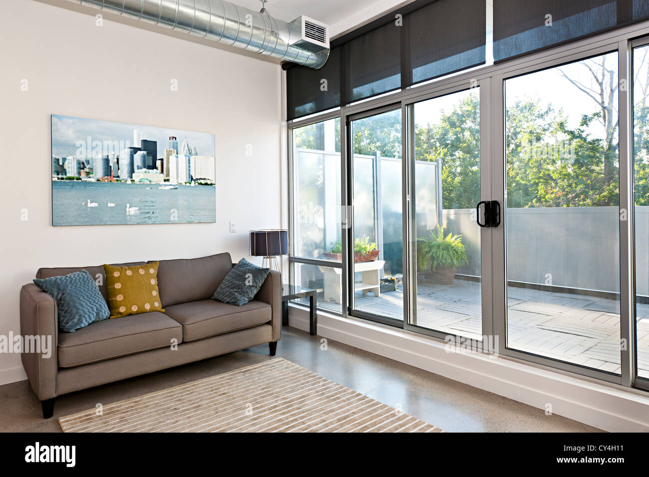 Living room with sliding glass door to balcony - artwork from photographer portfolio Stock Photo