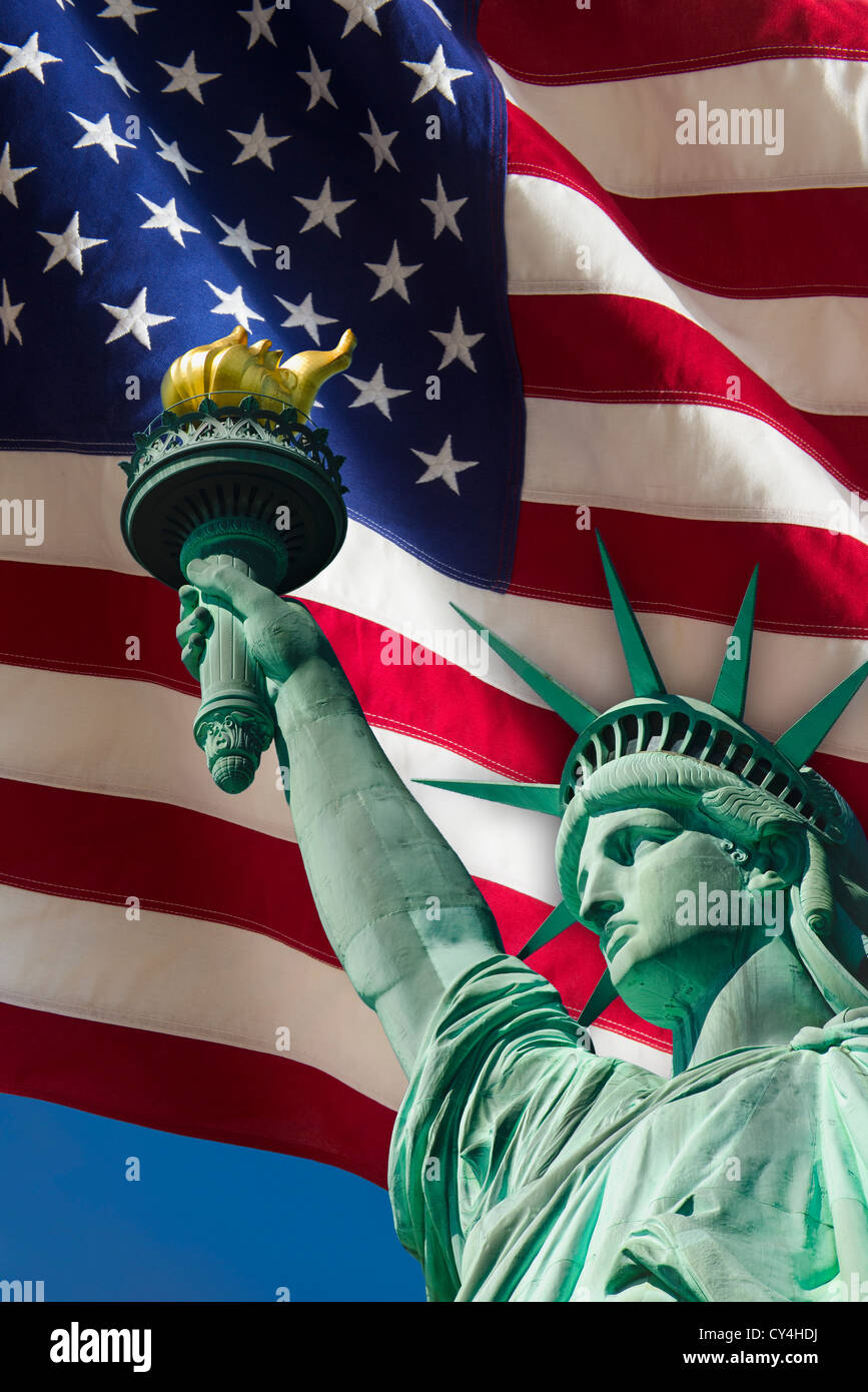 USA, New York City, Statue of liberty under US flag Stock Photo