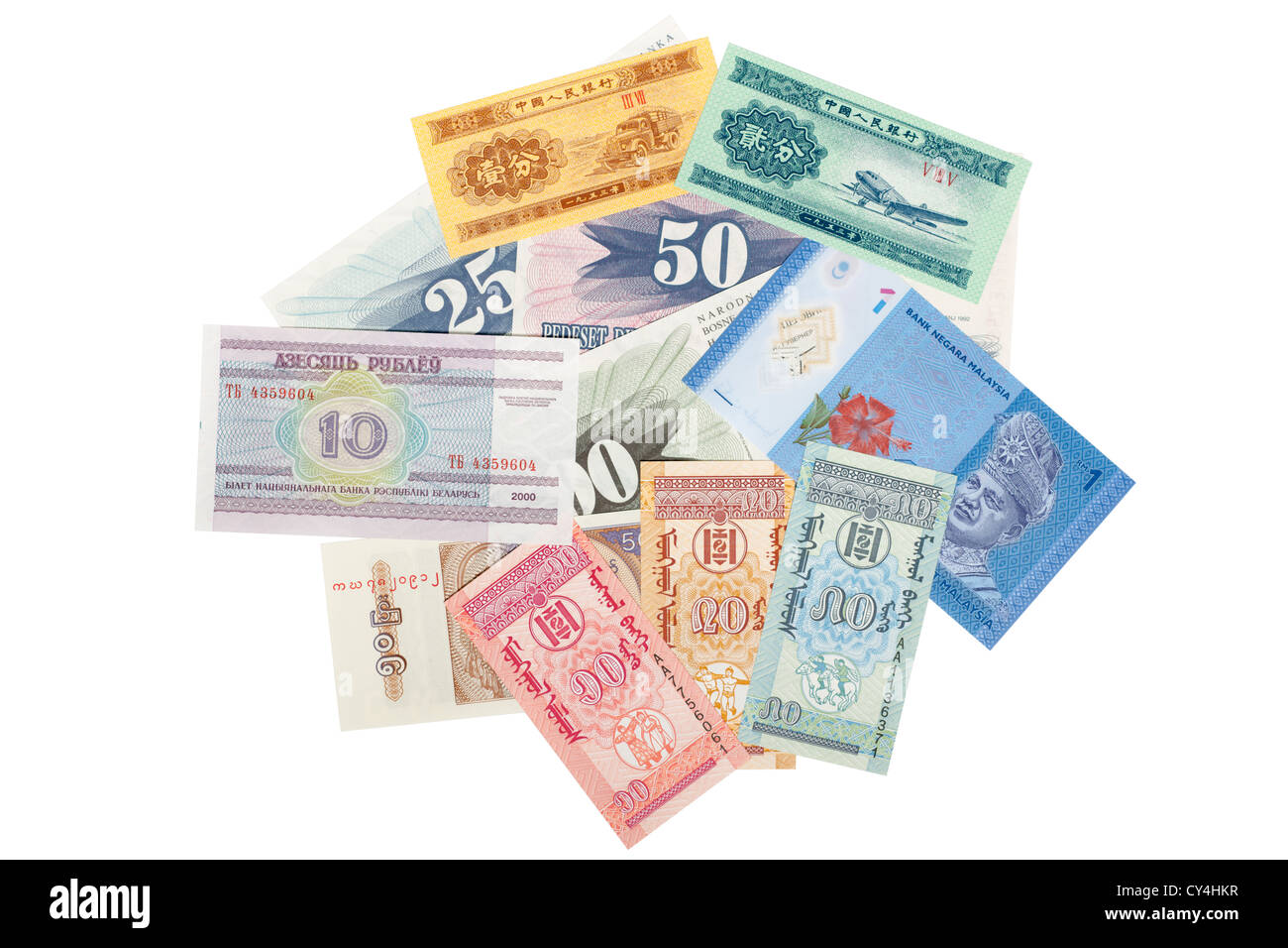 Pile of mixed foreign paper currency Stock Photo