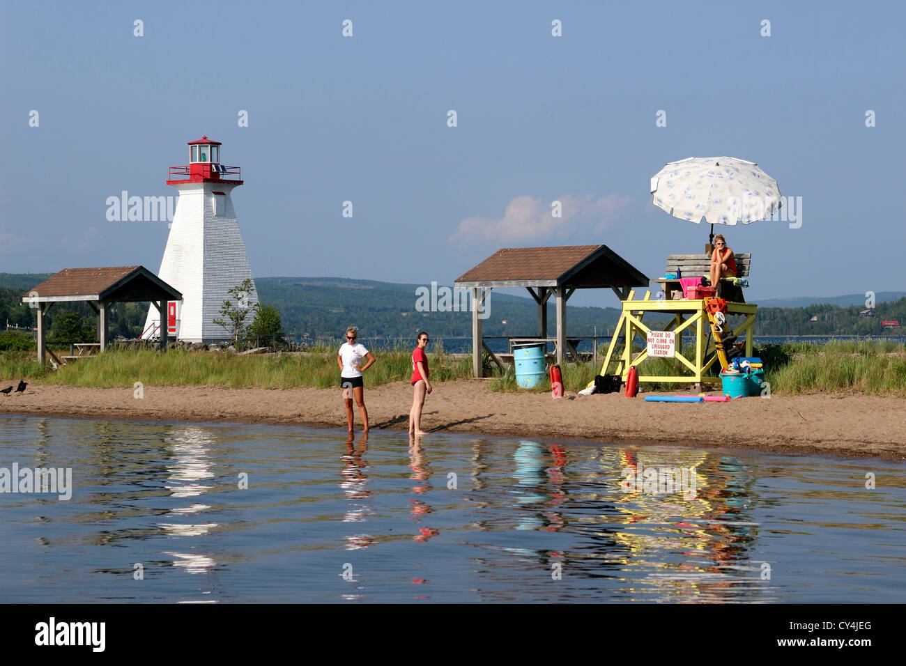 Canada Nova Scotia Cape Breton Baddeck Bras d'Or Lake lighthouse with beach lifeguard Stock Photo