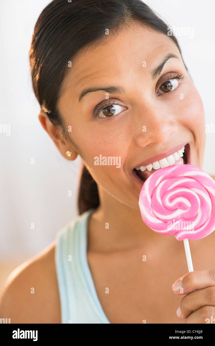 Woman eating lollypop Stock Photo