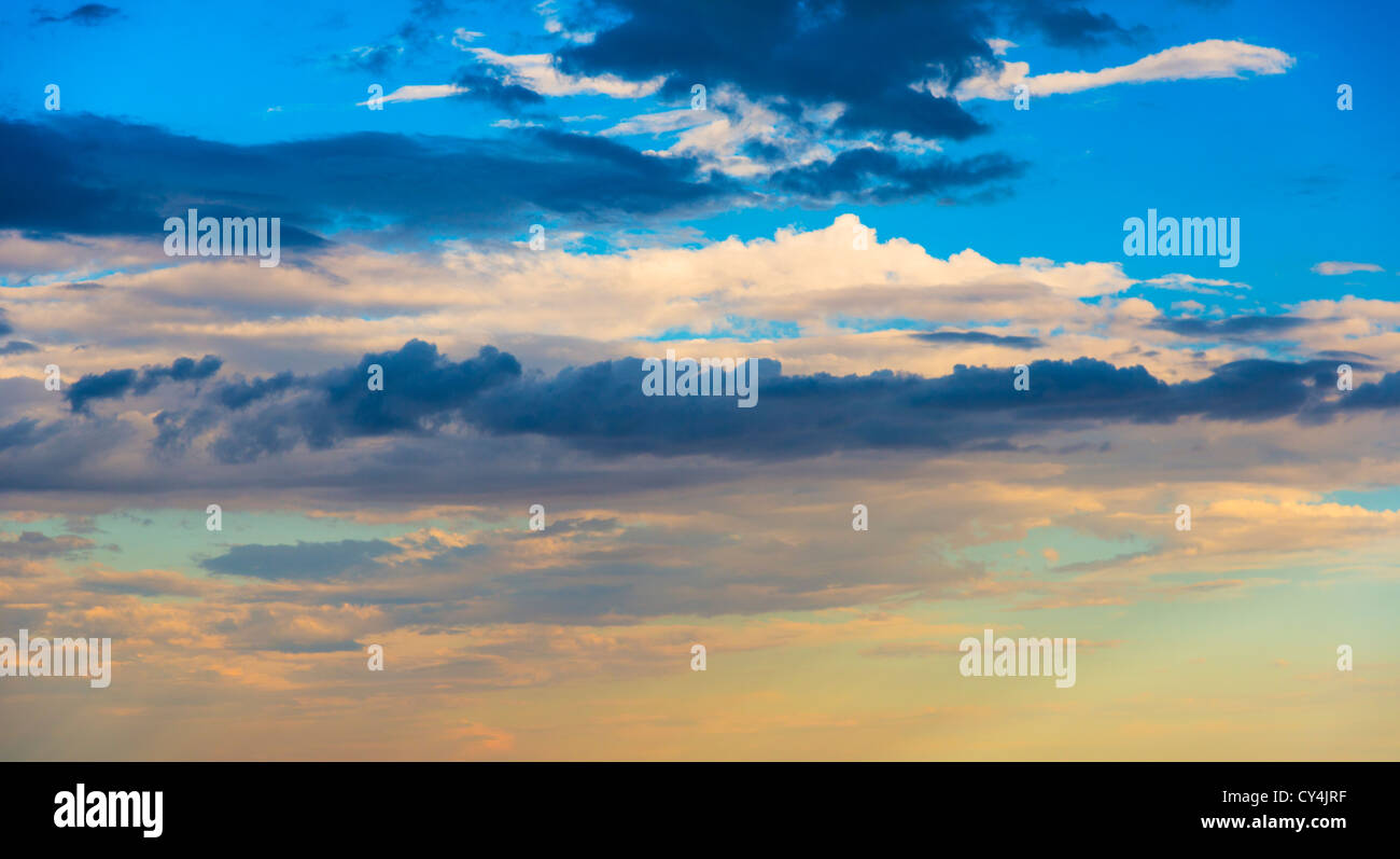 Sunset light on cloudy sky Stock Photo - Alamy
