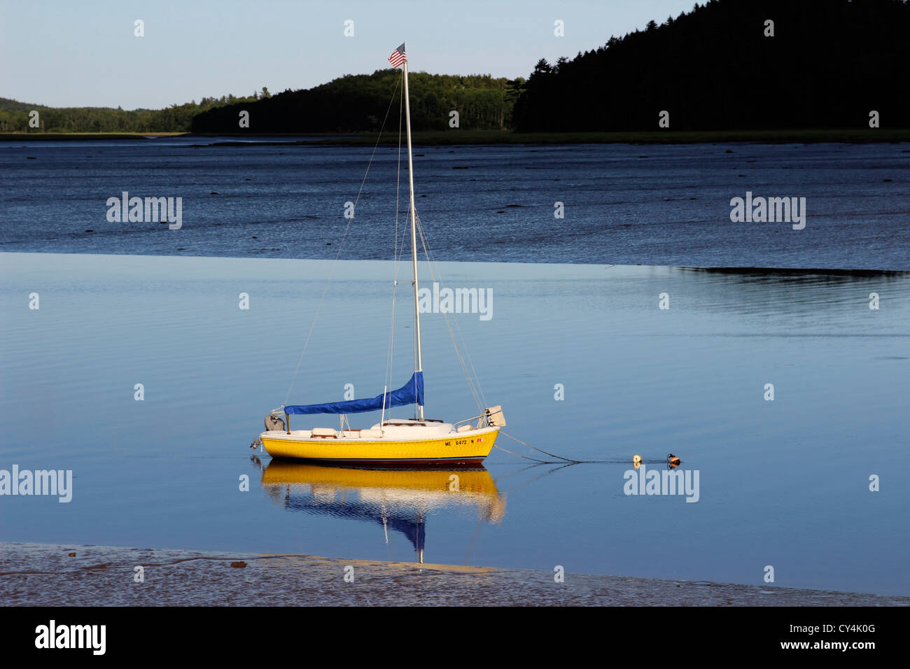 Maine Coast New England USA Machias yellow sailboat low tide Machias Bay Stock Photo