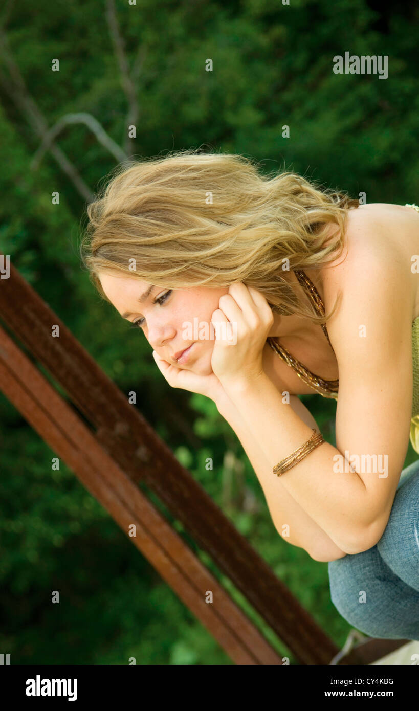pretty girl with solemn look thinking Stock Photo Alamy