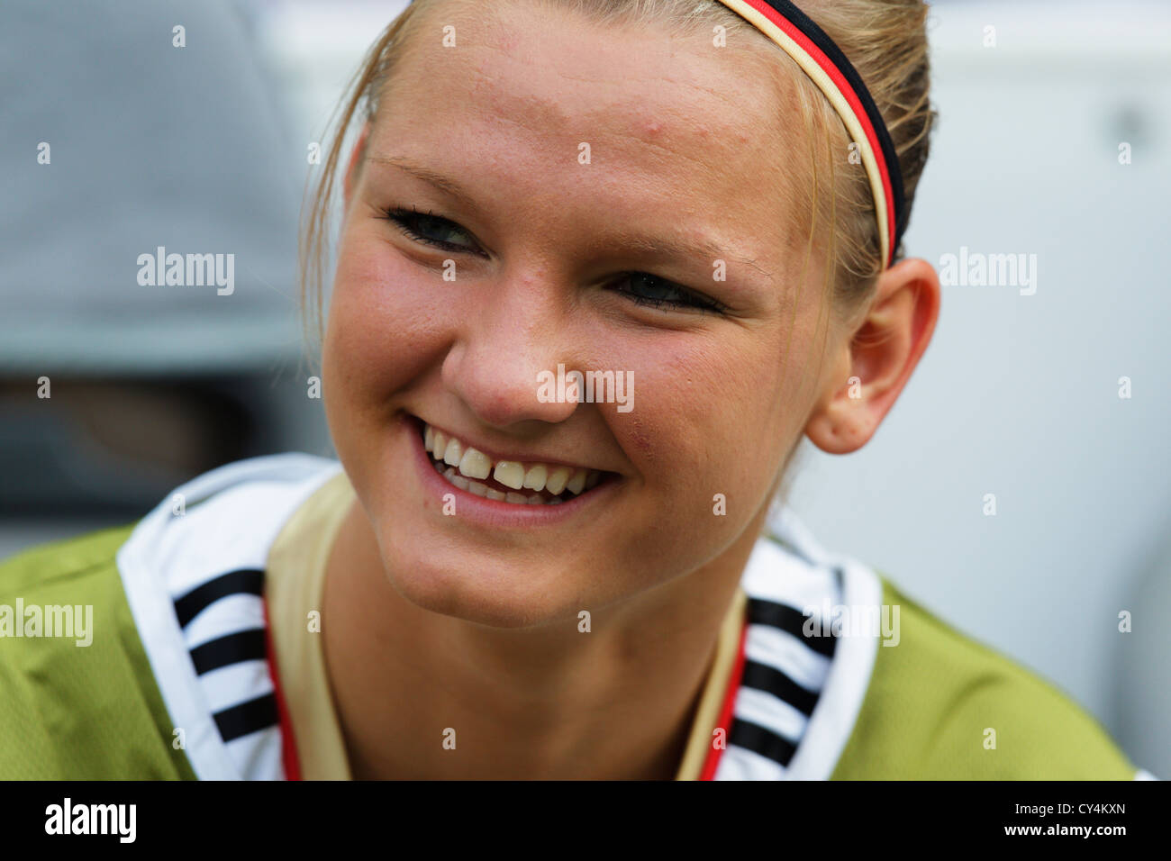 Alexandra Popp of Germany smiles from the team bench before the opening match of the FIFA Women's World Cup soccer tournament. Stock Photo