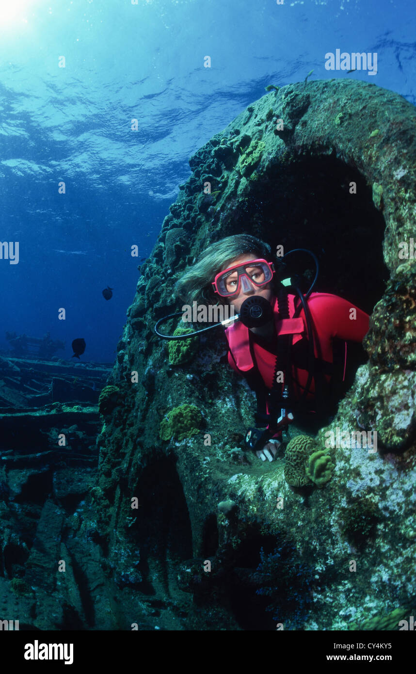 Diver on shipwreck near Conception Island, Bahamas Stock Photo