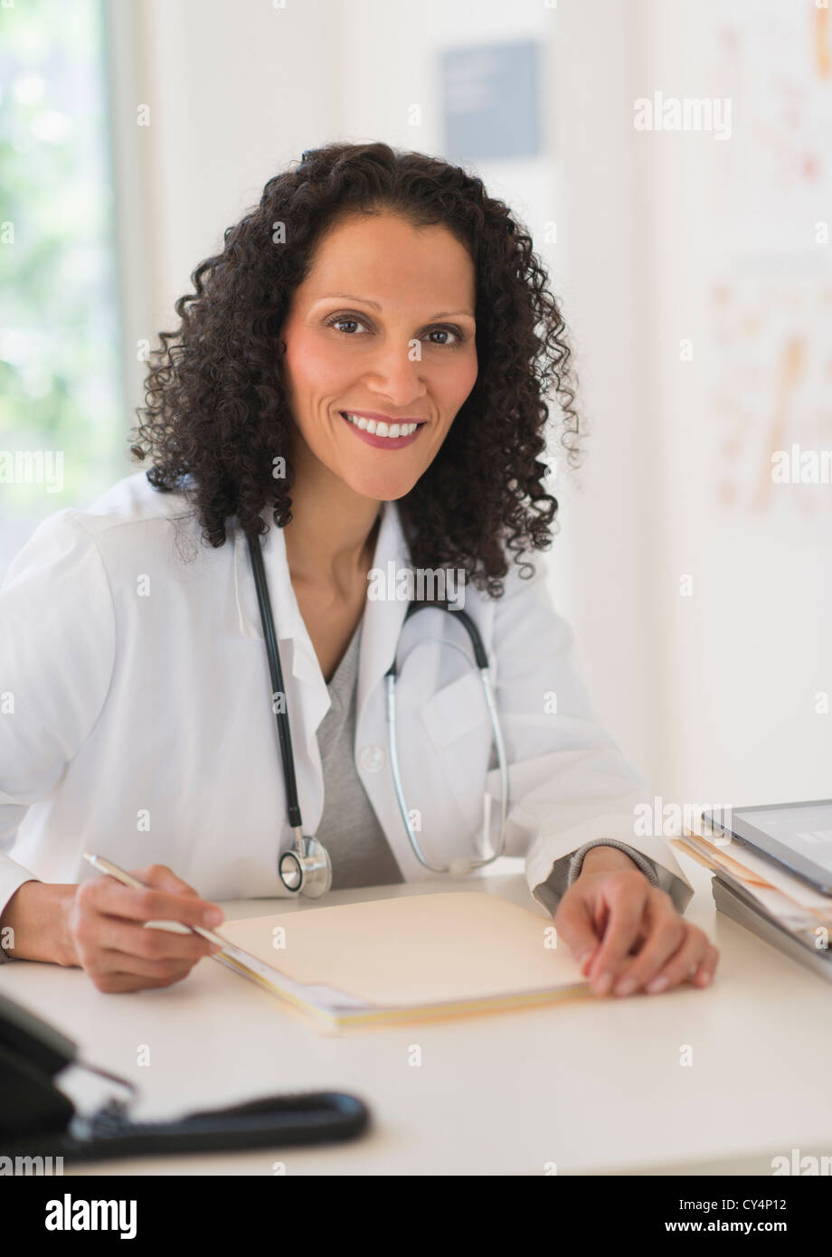 Black female doctor office sitting hi-res stock photography and images ...